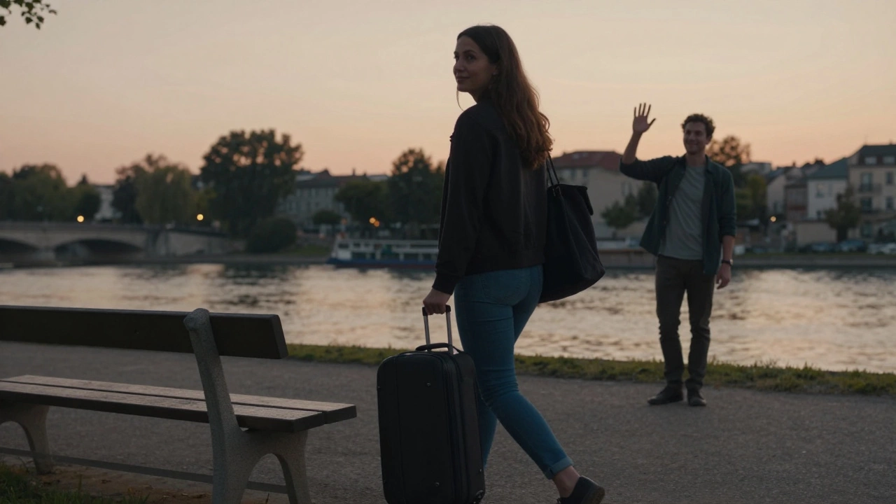 A woman walking away from a park bench at dusk, suitcase in hand, smiling calmly as she departs.